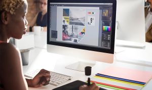 Designer creatively executing marketing collateral
