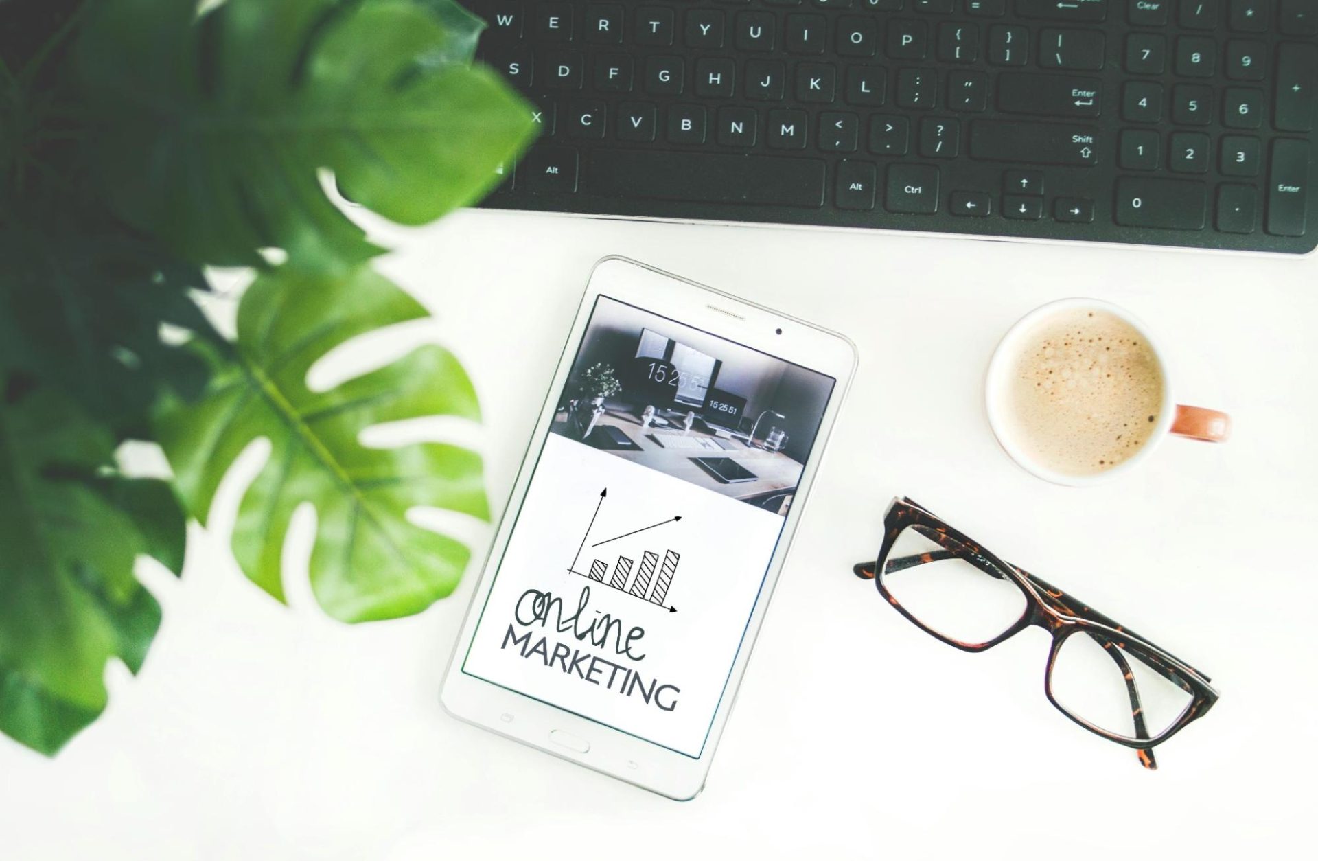 Brown framed eyeglasses and online marketing written on phone screen